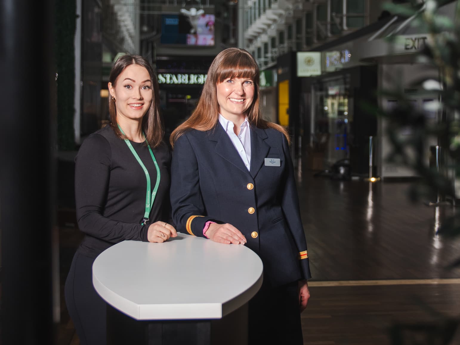 Two women smile and look into the camera. Tallink Silja's ship nurse Terhi Vuori and Mehiläinen's nutritionist Johanna Räsänen.